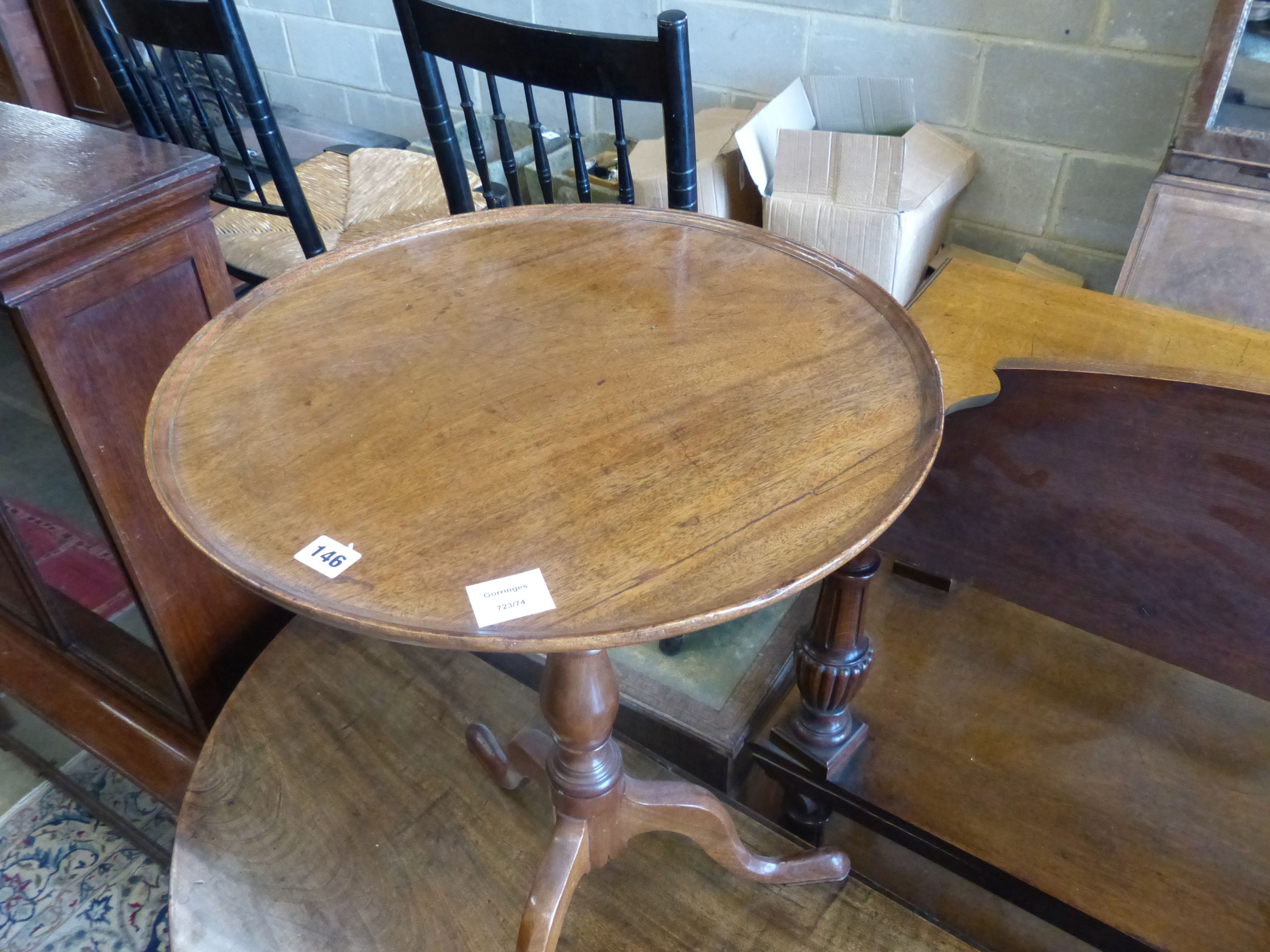 A George III circular mahogany tilt top tripod table, diameter 52cm, height 71cm